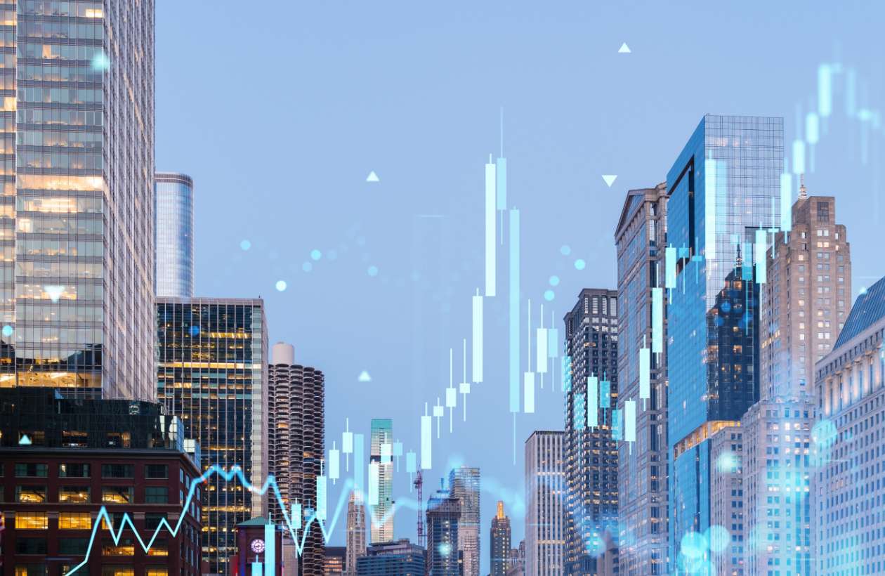 city skyline with stocks overlay