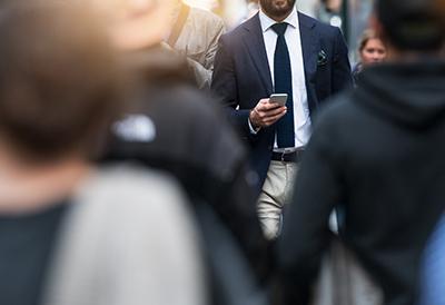 Professional man walking in a crowd