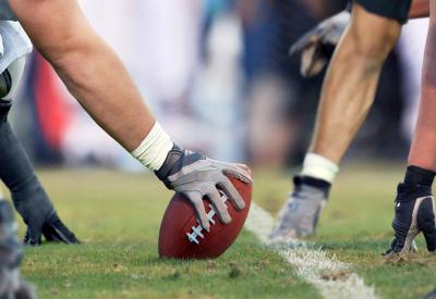 American football players at starting line