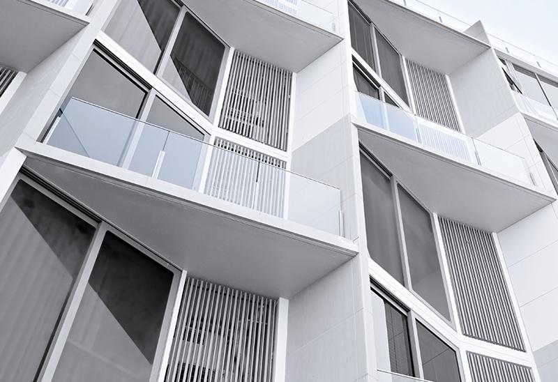 Geometric apartment building facade with balconies