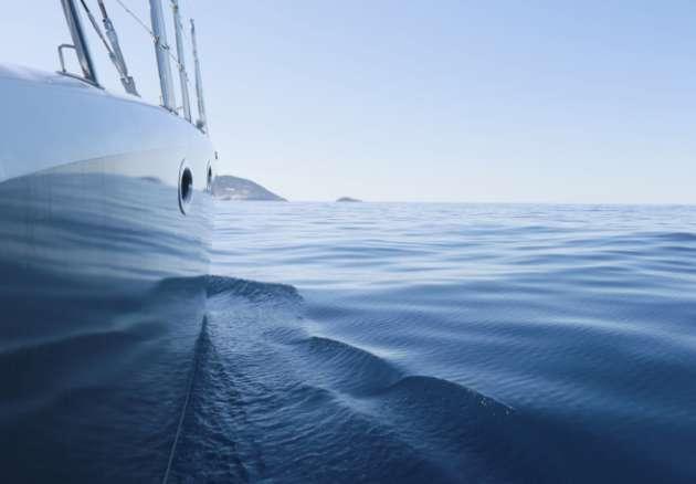 Side of a boat in calm water