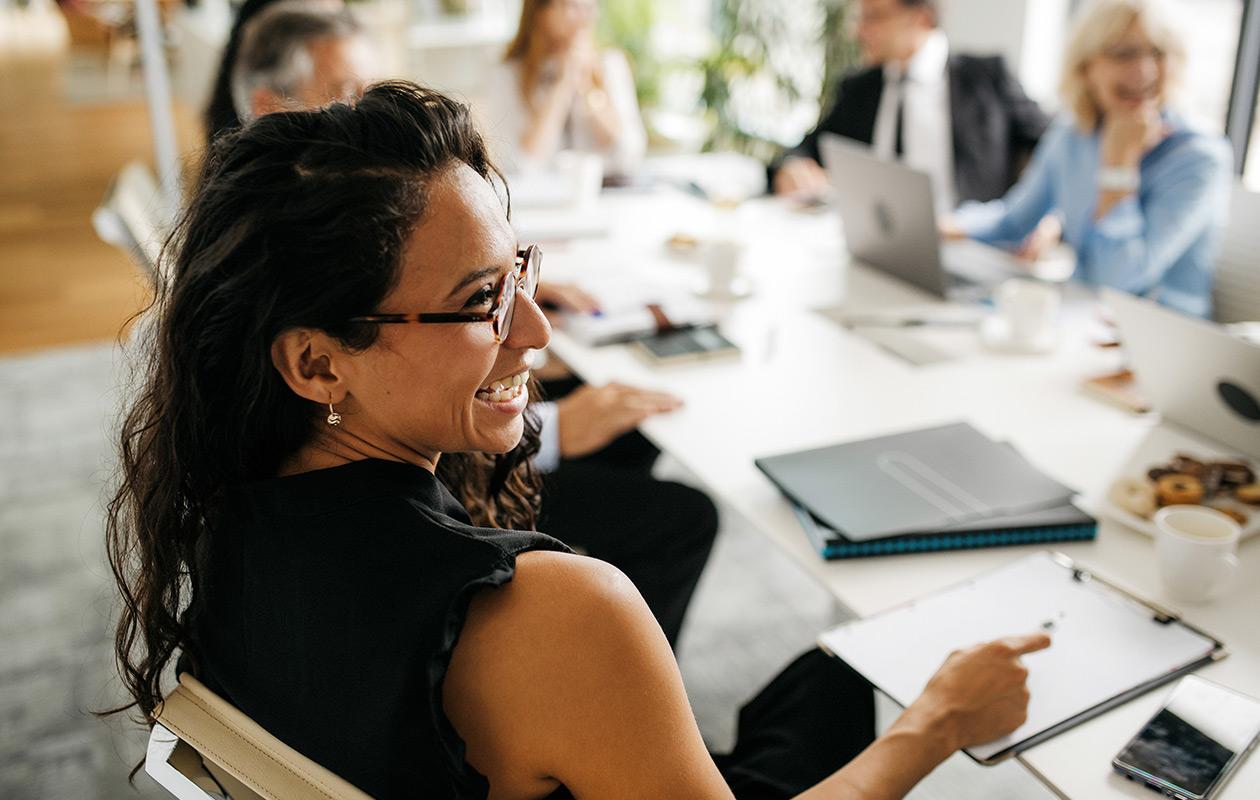 Woman smiling during a business meeting